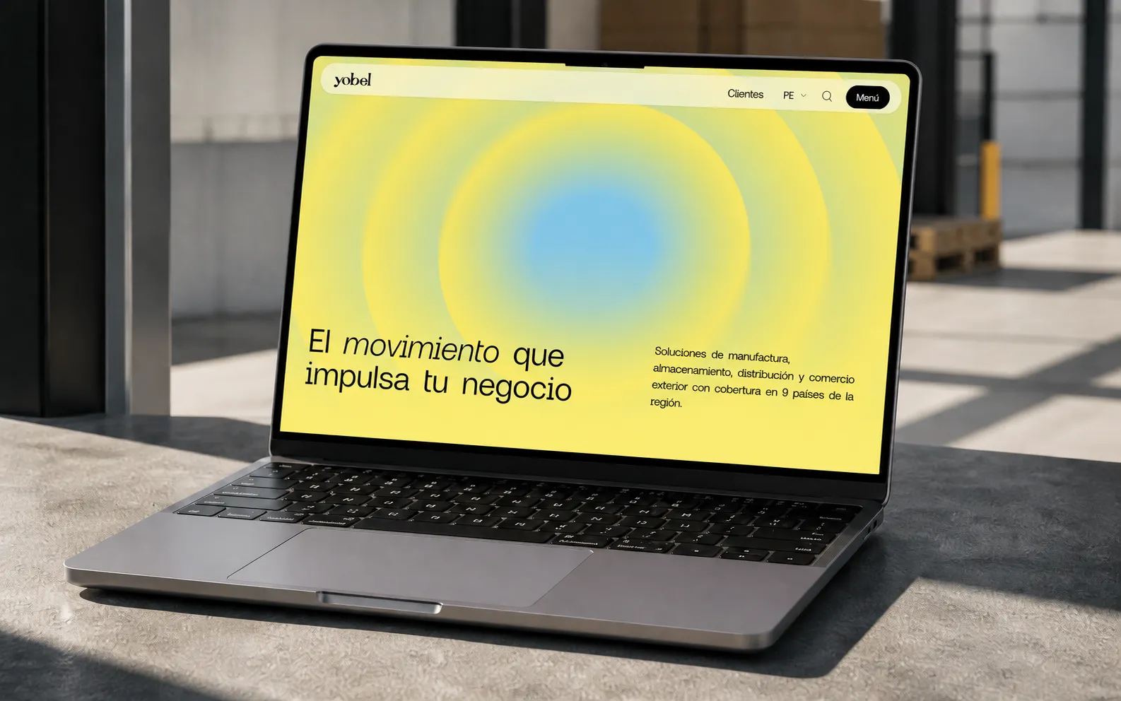 Yobel corporate website displayed on a laptop in an industrial setting